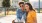 a man and woman sitting on a bench